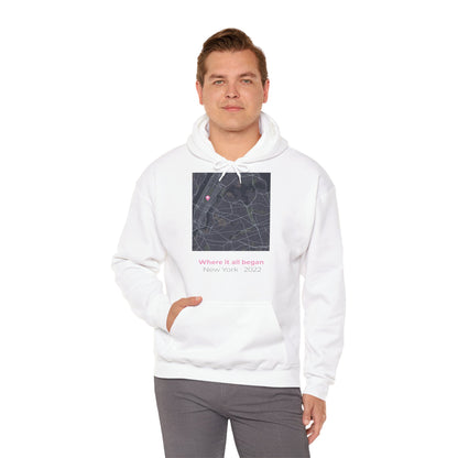 Man wearing a white hoodie with a graphic design on a white background