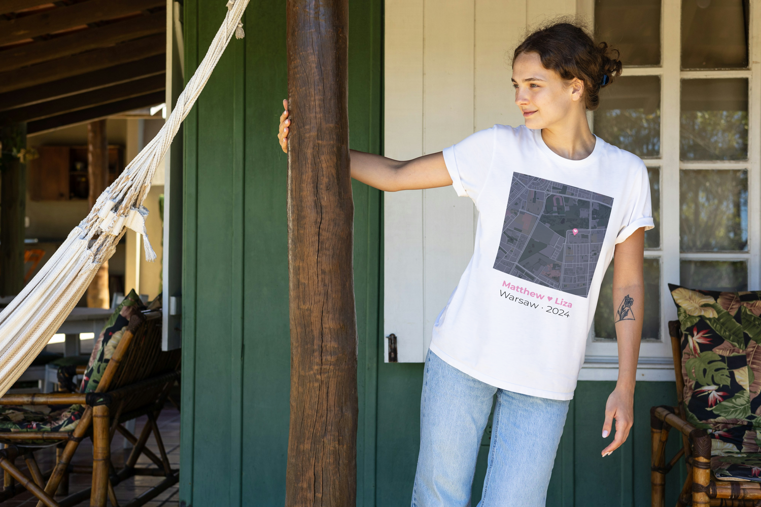 Woman wearing a personalized love map t-shirt showing custom city map with heart pin